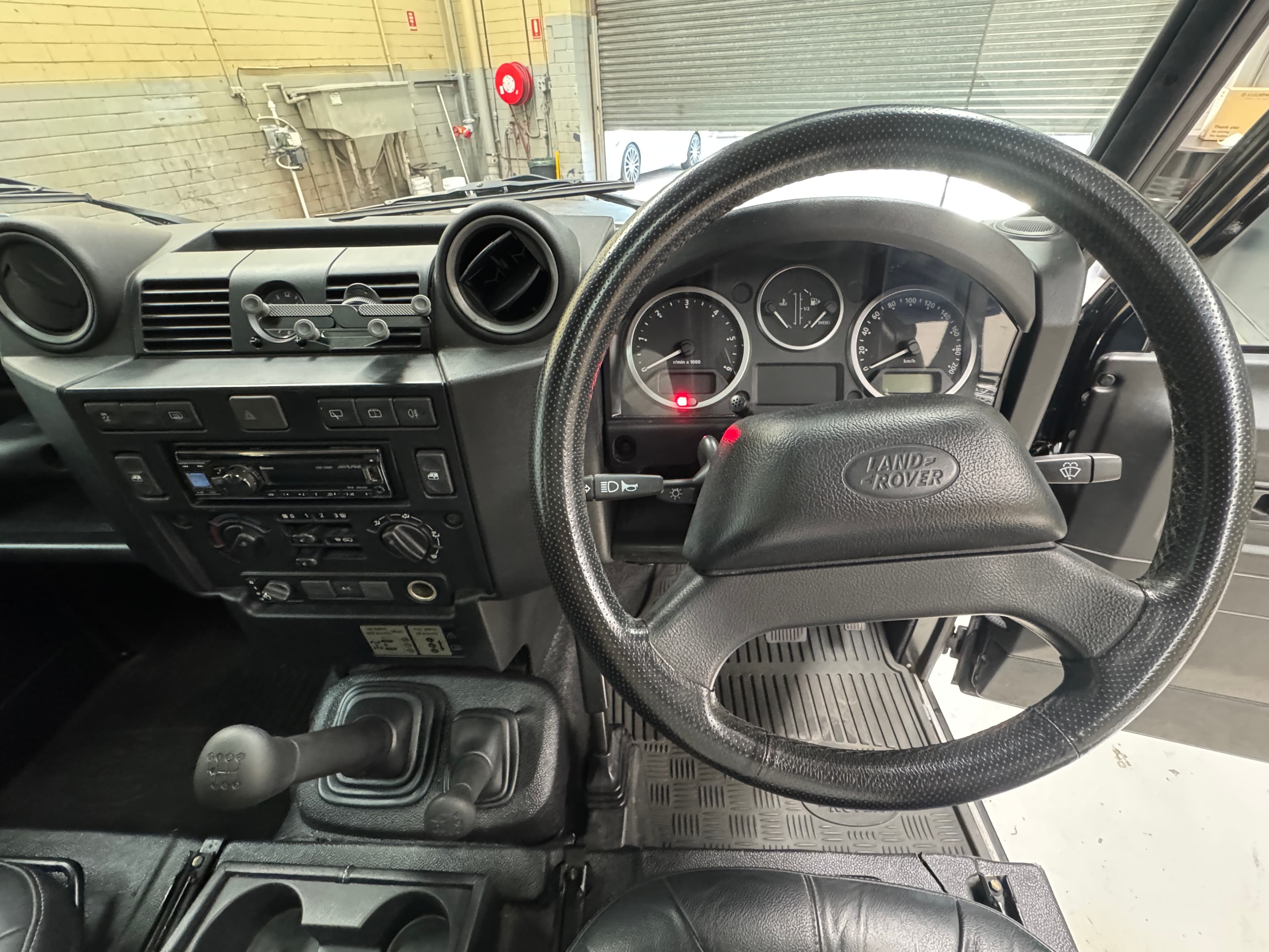 2014 Land Rover Defender DEFENDER 90 MY15 DIESEL TURBO F/INJ 2.2L 6 SP MANUAL in BLACK — front seats